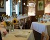 Croissants pet friendly bakery and bistro's dining room with sun flowers on the table and white table cloths